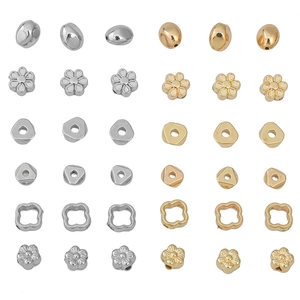 Selection of gold and silver CCB plastic beads in star, clover, and floral shapes for DIY