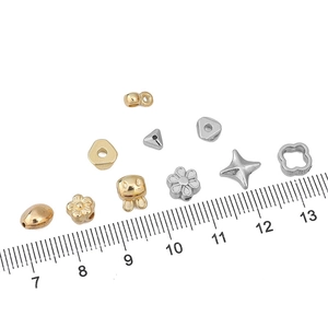Detailed view of CCB plastic DIY beads in star and clover shapes with size ruler