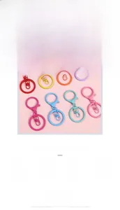 Macro detail of matte spray-painted metal keychains with lobster clasps in various colors