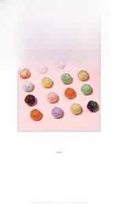 Macro detail of acrylic beads shaped like colorful yarn balls for DIY jewelry making