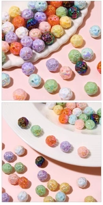 Detail of colorful acrylic beads with hollow rose flower patterns for DIY jewelry making