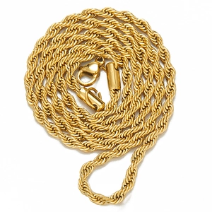 Close-up of golden rope chain necklace with classic lobster clasp and twisted texture