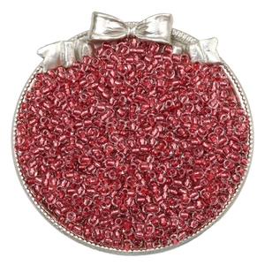 Red silver-lined glass seed beads for DIY jewelry in a decorative silver metal tray