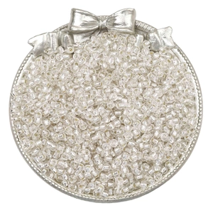 Macro detail of transparent silver-lined glass seed beads for DIY jewelry making