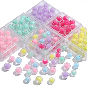 Colorful striped acrylic beads set in transparent storage boxes for DIY jewelry making