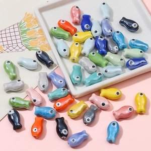 Colorful ceramic fish beads in various glossy glazes for DIY jewelry making and crafts