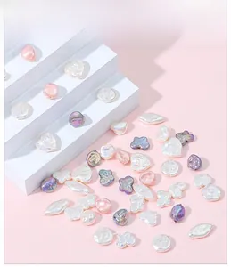 Detailed view of iridescent baroque faux pearl beads in heart and flower shapes for DIY
