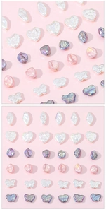 Detailed view of iridescent heart and butterfly charms for DIY jewelry making