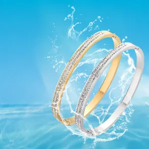Eleganti bracciali in acciaio al titanio con doppia fila di strass in oro e argento