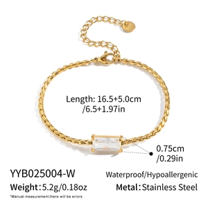 Detail of gold twisted chain bracelet with rectangular zircon and lobster clasp closure