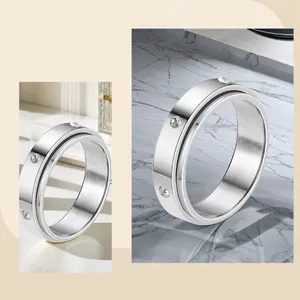 Macro detail of rotating stainless steel ring with elegant inset cubic zirconia stones