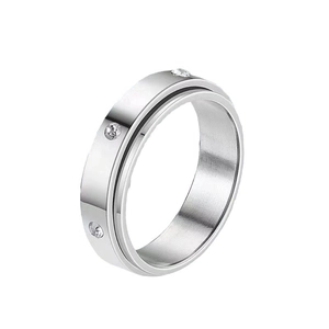 Modern silver stainless steel spinner ring with embedded crystals for stress relief