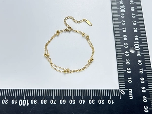 Bracelet double couche en acier doré à billes avec règle pour référence de taille