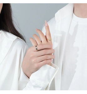 Close-up of S925 silver couple rings featuring honeybee design on model hands