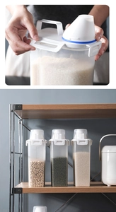 Detail showing airtight lid with handle, funnel measuring cup, and capacity scale