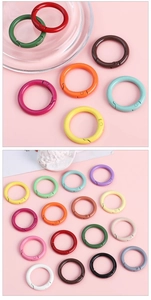 Detailed close-up of 30mm colorful metal spring rings for DIY keychains and phone straps