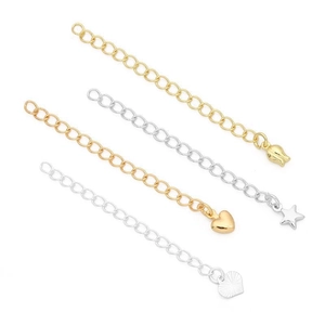 Detail of 14K gold and silver plated extender chains with star, heart, and flower charms