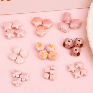 Pink ceramic beads in cat paw flower and star shapes for DIY jewelry making