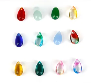 Macro shot of 12 colorful teardrop glass beads with top drill holes for DIY jewelry