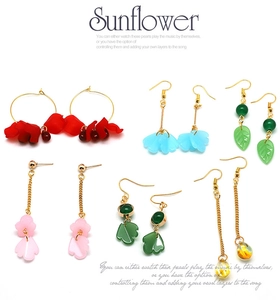 Detail of assorted flower and petal glass earrings including red, blue and green styles