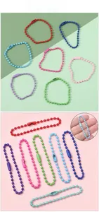 Macro detail of colorful metal ball chains in various candy colors for DIY jewelry making