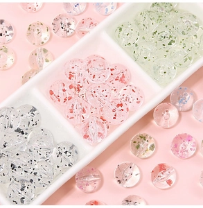 Macro detail of acrylic flower beads in various colors for DIY jewelry crafting