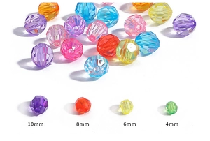 Detail view of colorful faceted acrylic loose beads in various candy colors and sizes