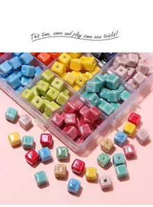 Macro shot of colorful glazed ceramic cube spacer beads for DIY jewelry making