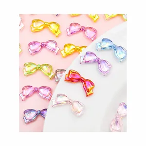 Close-up of colorful iridescent acrylic bow beads for DIY craft and jewelry making