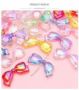 Macro shot of colorful iridescent acrylic bow beads for DIY jewelry making accessories