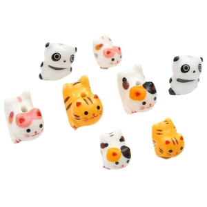 Hand-painted ceramic beads featuring cartoon panda and cat designs for DIY jewelry crafting