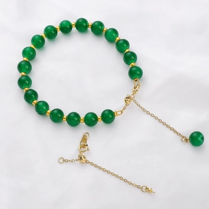 Verstelbare armband met groene kralen, gouden karabijnsluiting en verlengketting set