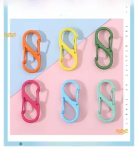 Detail view of colorful S-shaped alloy spring clasps for DIY keychains in six vibrant colors