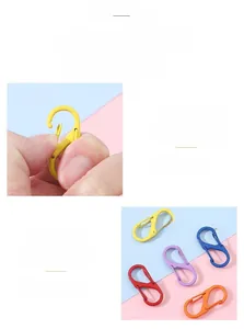 Detail showing colorful S-shaped alloy spring clips with smooth painted finish for keychains