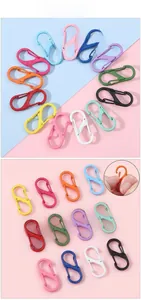 Macro shot of colorful S-shaped double spring buckles and functional opening detail