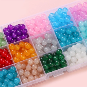 Colorful 6mm to 8mm round glass jelly beads set in transparent plastic storage box