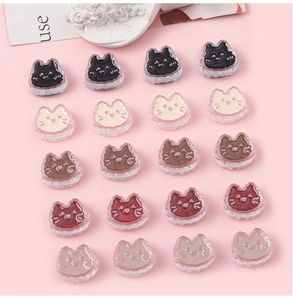 Flat lay of 20 cute acrylic cat charms in five colors for DIY jewelry making