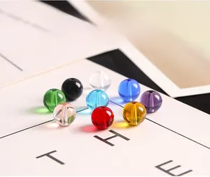 Detailed macro view of colorful round glass beads for DIY jewelry with through holes