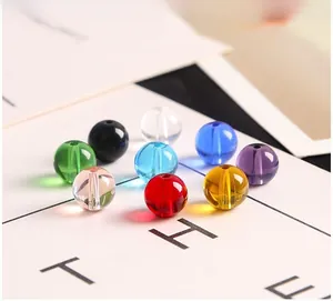 Detailed view of colorful polished glass crystal round beads for DIY jewelry making