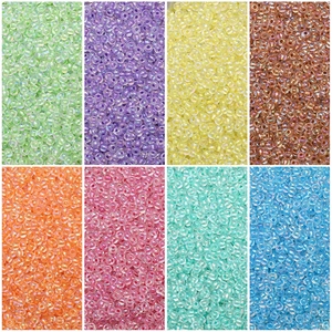 Macro view of 2-4mm iridescent glass seed beads in eight vibrant colors for DIY jewelry making