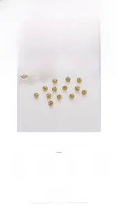 Macro detail of 14k gold-filled hollow floral spacer beads with pearls for jewelry DIY