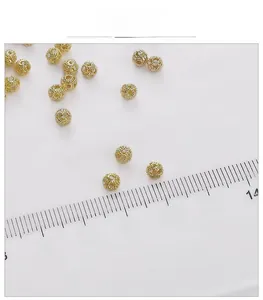 Macro shot of 14k gold-filled hollow floral beads for DIY jewelry making accessories