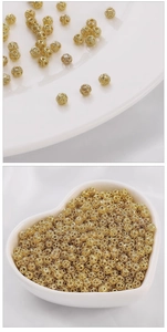Macro detail of 14k gold-filled hollow bead connectors for DIY jewelry making