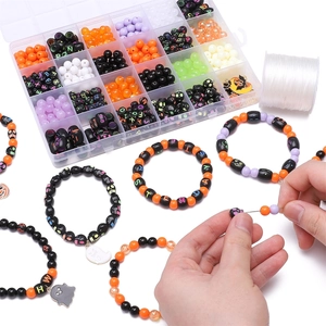 Macro view of 24-compartment Halloween jewelry DIY kit with beads and ghost charms