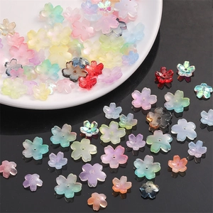 Macro view of cherry blossom glass beads with center holes for DIY jewelry making