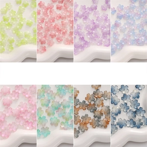 Macro detail of cherry blossom glass beads in 8 gradient colors for DIY jewelry making
