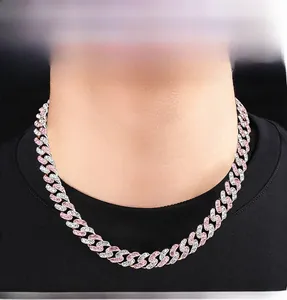 Close-up of hiphop Cuban link necklace with pink and white pavé cubic zirconia