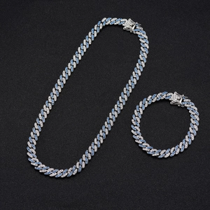 Detail of silver Cuban chain set with alternating white and light blue rhinestones
