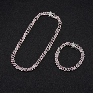 Detailed view of hip-hop cuban link chain set with pink and clear micro-pave zircons