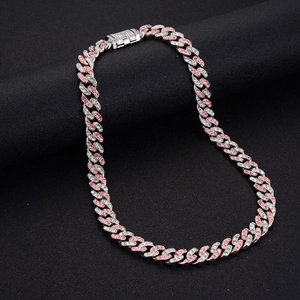 Hip hop two-tone Cuban link necklace with pink and clear crystals on black texture